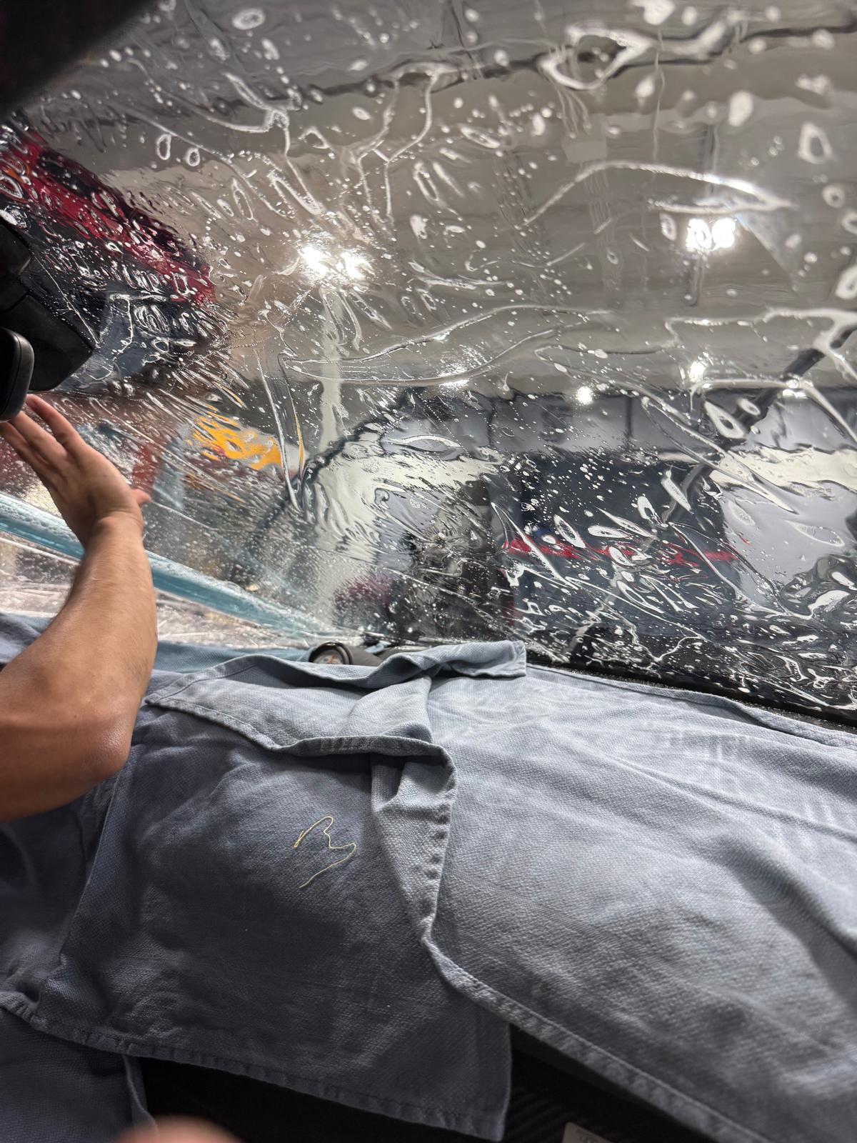 Window tint film being installed on a side window