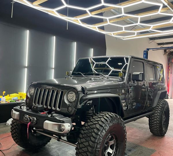 Dark gray Jeep Wrangler with window tint installed