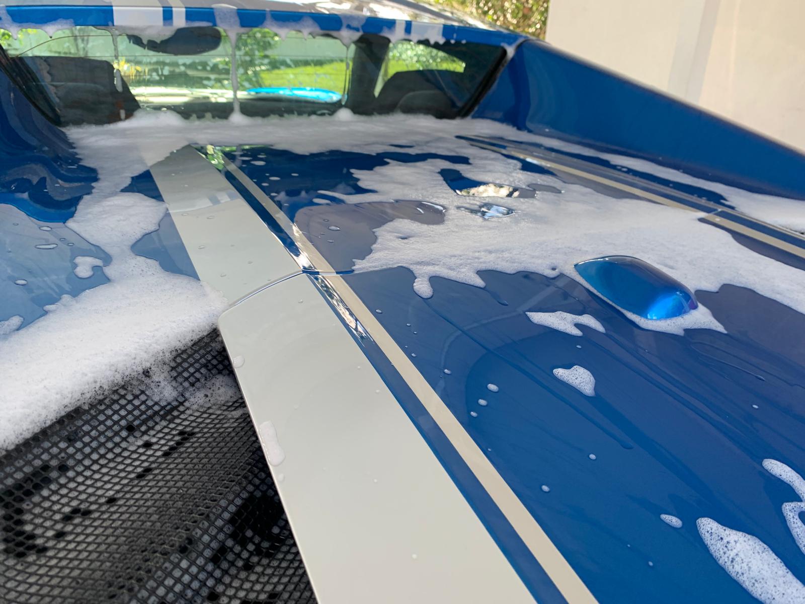 Thick foam covering a car during a hand wash